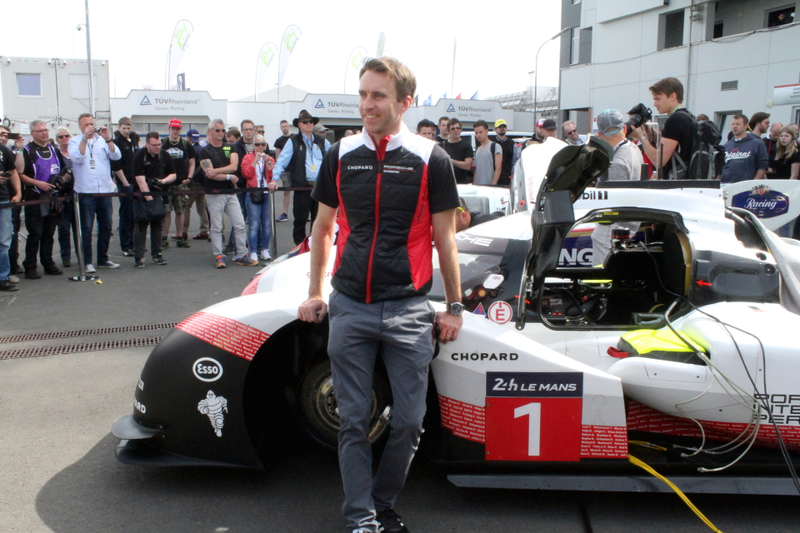 Driver Timo Bernhard with the car at the Nürburgring 24 Hours.